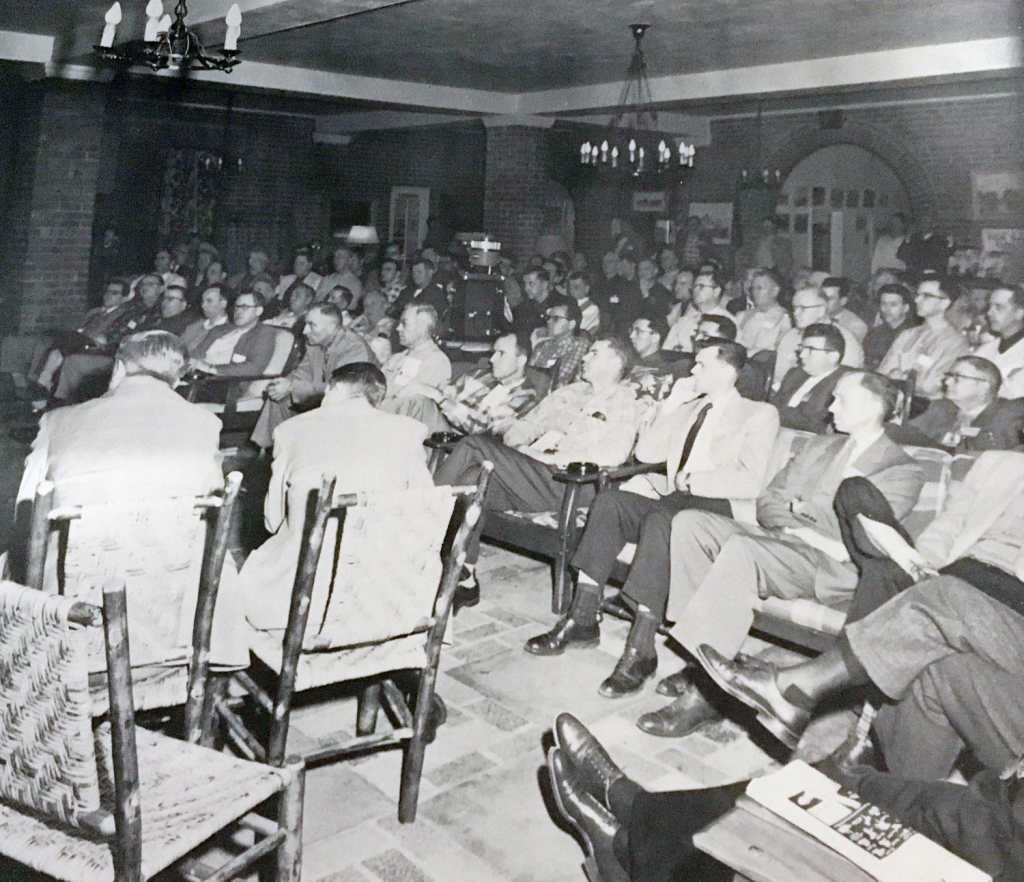 A group of people sitting attending one of the first GLPTI's